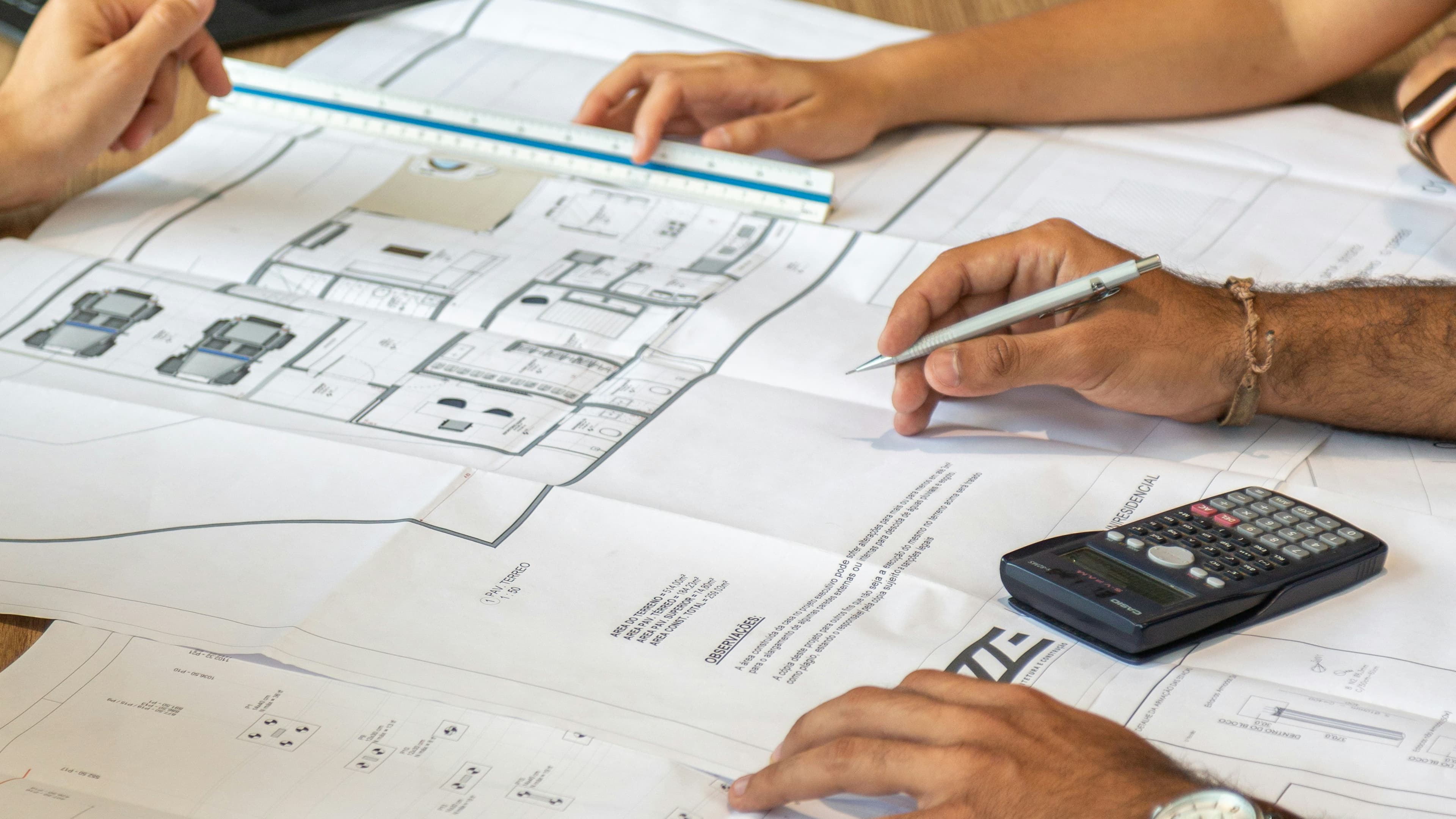 Architectural team reviewing drawings as the starting point for a three-dimensional environment