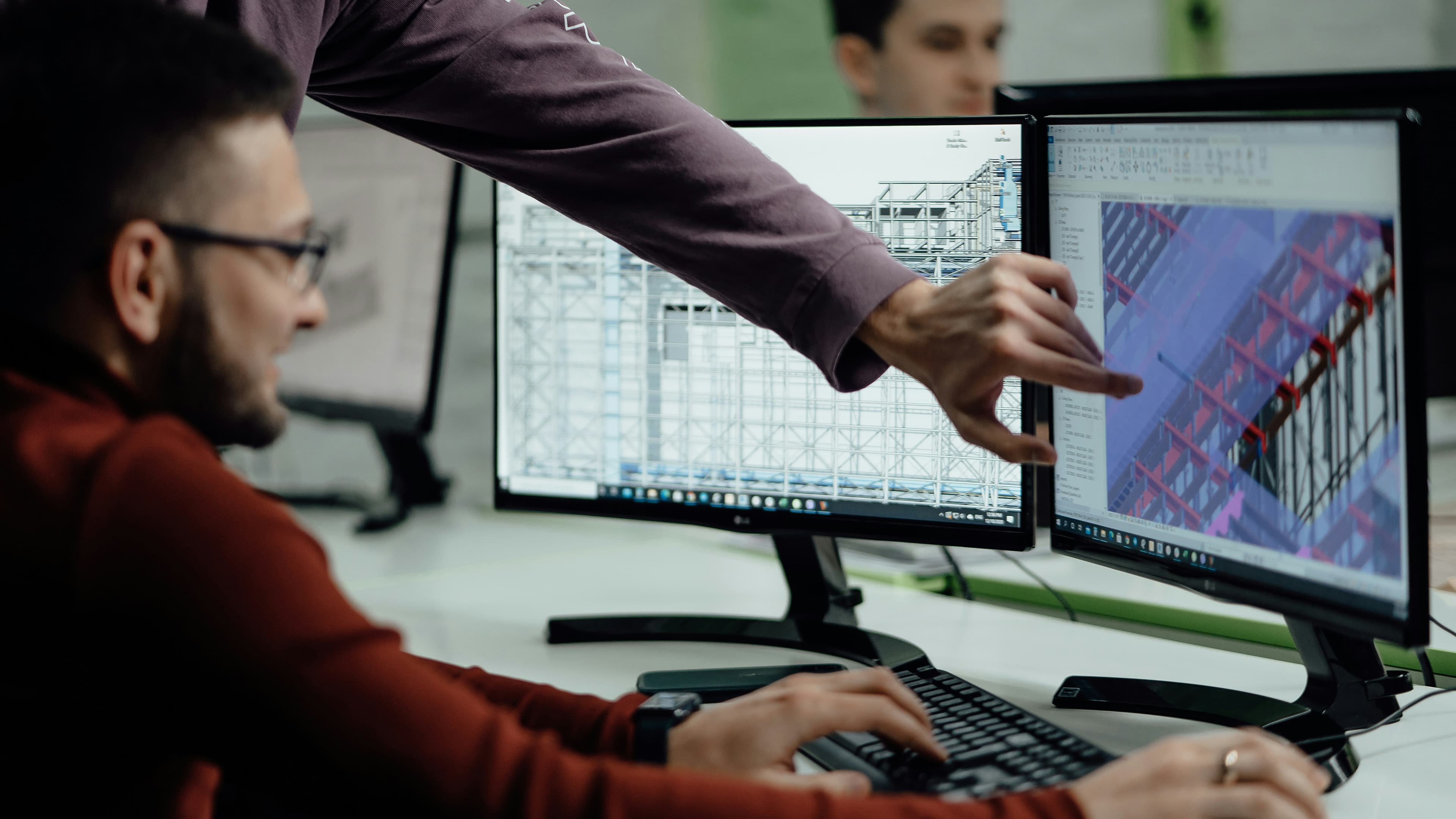 Visualization specialists coordinating an architectural model handoff